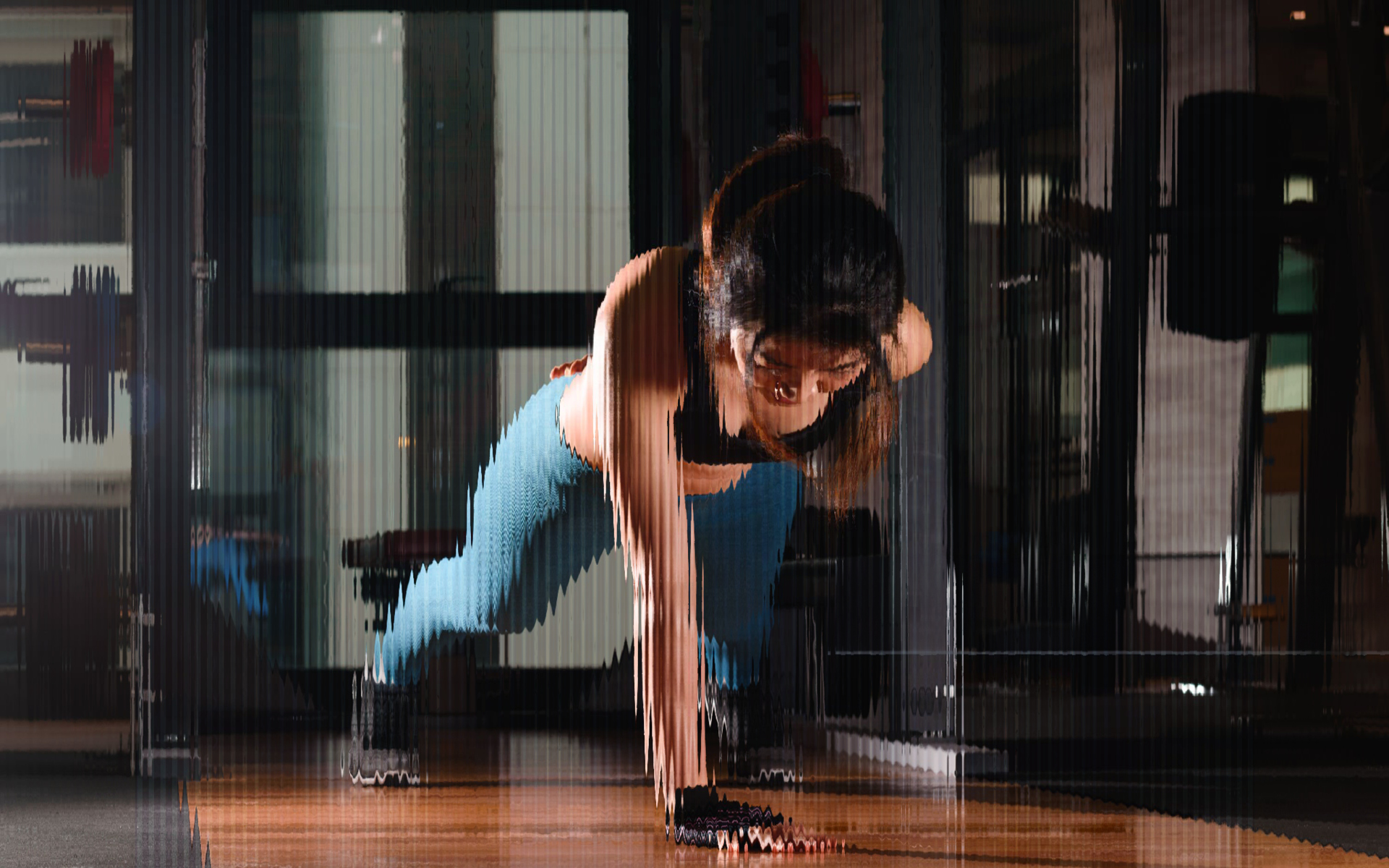 Accent photo of woman working out doing a pushup.